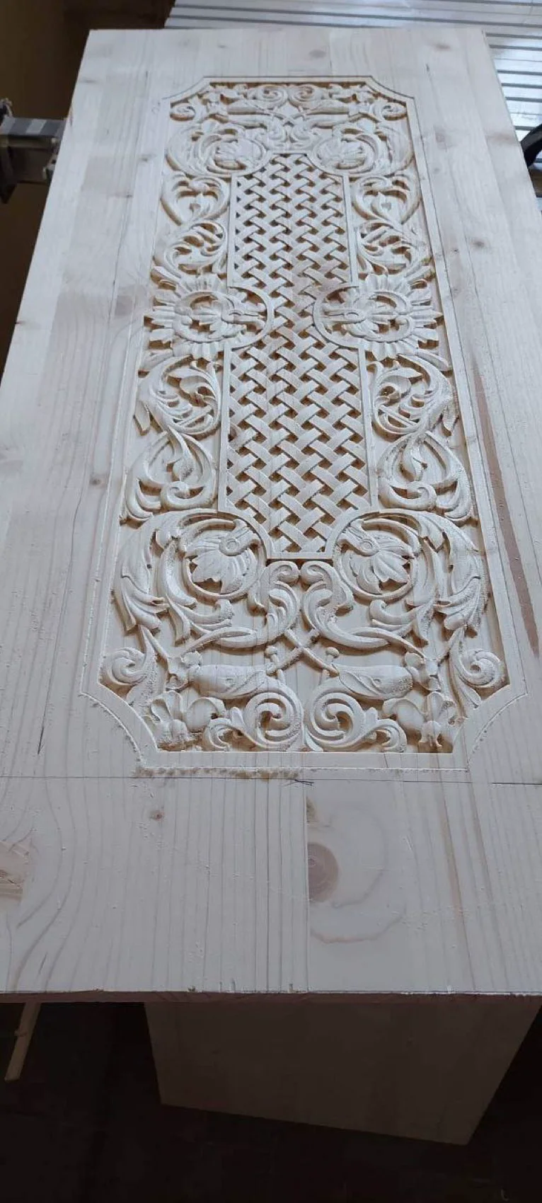 Carved ornamental basket-weave panel