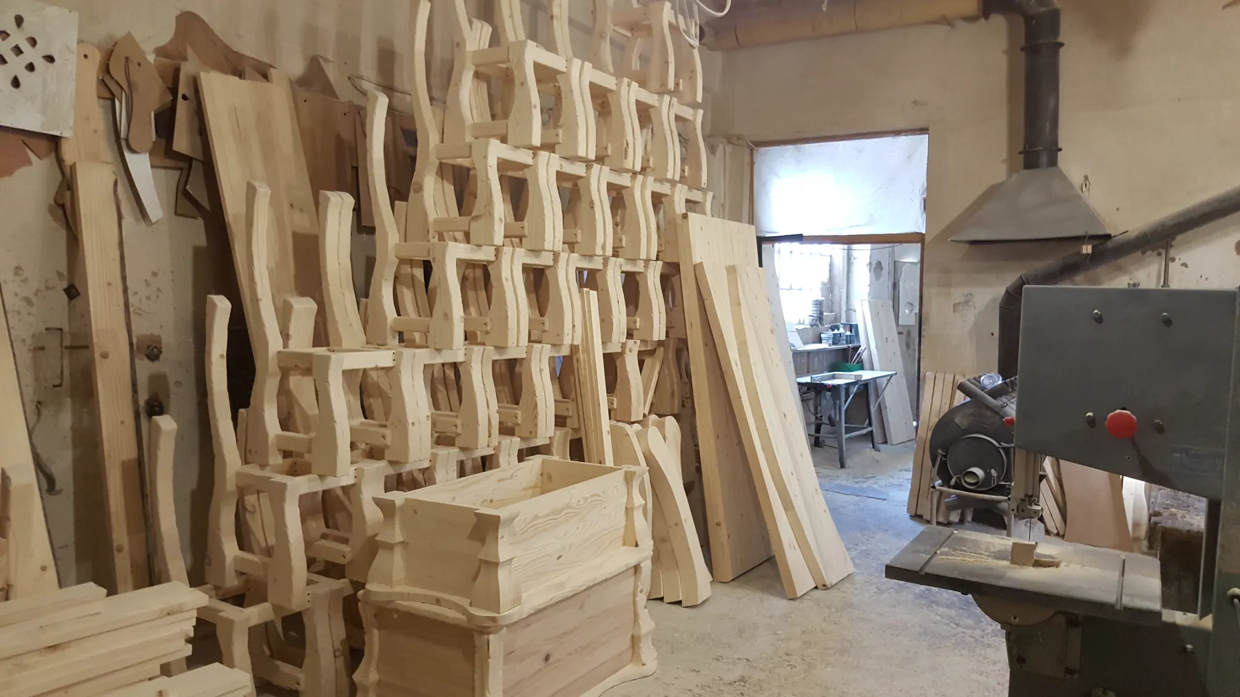 Workshop with shaped wood parts and bandsaw